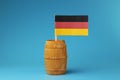 A view on national flag of Germany on wooden stick in wooden barrel