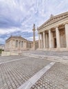 Athens Greece, a view of the national university classical building facade with Athena statue standing on Ionian style column.