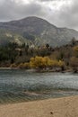 A view of the natural Lake Tsivilu Peloponnesus, Greece and mountains around on a cloudy winter day Royalty Free Stock Photo