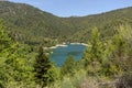 A view of the natural Lake Tsivilu Peloponnesus, Greece and mountains around on a sunny, summer day Royalty Free Stock Photo