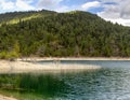 A view of the natural Lake Tsivilu Peloponnesus, Greece and mountains around on a cloudy winter day Royalty Free Stock Photo