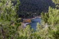 A view of the natural Lake Tsivilu Peloponnesus, Greece and mountains around on a cloudy winter day Royalty Free Stock Photo