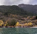 A view of the natural Lake Tsivilu Peloponnesus, Greece and mountains around on a cloudy winter day Royalty Free Stock Photo