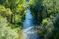 View of a natural pool formed by large rocks in the Mijares river as it passes through the town of Olba