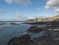 view of Natural sea pool Las Salinas de Agaete in Puerto de Las Nieves and coast cliffs. Gran Canaria, Spain. Royalty Free Stock Photo