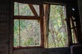 View of a nature from the broken wooden window Royalty Free Stock Photo