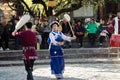 Naxi man and woman performing a traditional cultural dance Lijiang old town Yunnan China
