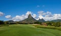 Rempart Mountain overlooking the 2nd Tee of Tamarin Bay Golf Course in Mauritius.