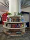 View of neatly arranged books on tiered and circular bookshelves