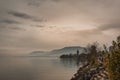 View of Neuchatel lake by beautiful misty sunset