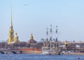 View of the Neva embankment in St. Petersburg with the Petropavlovsk fortress, sailing ship and golden domes of Royalty Free Stock Photo