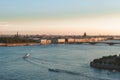 Neva river and the city of Saint Petersburg from above, boats on the water, buildings, embankment at sunset Royalty Free Stock Photo