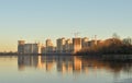 View of Neva River and modern residential buildings under construction on the outskirts of St. Petersburg at sunny autumn evening Royalty Free Stock Photo