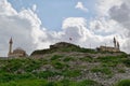 View of Nevsehir Castle on a hill against the background of the cloudy blue sky. Cappadocia, Turkey. Royalty Free Stock Photo