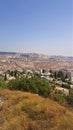View of a new area in Jerusalem, against a blue sky and a yellow lawn with dried grass, Israel Royalty Free Stock Photo