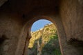 View of the new bridge of the village of Ronda through the old destroyed arch