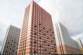 The view of new high-rise buildings with beautiful stripes of white orange brown balconies and areas for air conditioning