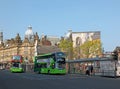 view of new market street with two first buses stopped picking up passengers in leeds city centre