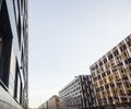 view on new modern buildings, facade corner and sky, real parkings on line