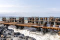 View of the new pier piles of the harbor. A pile or piling is a vertical structural element of a deep foundation, driven or drille Royalty Free Stock Photo
