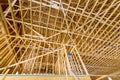 View of new residential house with wooden truss post beam stick built construction framing