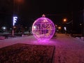 New year street decoration of a spheric form with violet lightning.