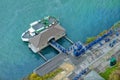 View on New York state Buffalo city Niagara Falls sightseeing tours boat at pier and boarding people tourists in blue navy raincoa