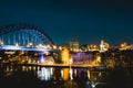 View of Newcastle Quayside and Tyne Bridge, illuminated at night on a clear evening