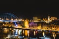 View of Newcastle Quayside and Tyne Bridge, illuminated at night on a clear evening. HMS Calliope and Helipad in foreground Royalty Free Stock Photo