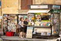 View of newspaper and magzine stand on the corner of small backstreets in the centre of Florence