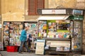 View of newspaper and magzine stand on the corner of small backstreets in the centre of Florence
