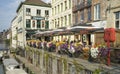 View of a nice corner with a terrace of a riverside bar in the Belgian city of Ghent.