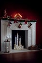 View of nice white christmas decorated fireplace Royalty Free Stock Photo