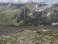 View from Niederl saddle on Nurnberger Hutte mountain hut and snow-capped peaks at Stubai hiking trail, Stubai Hohenweg Royalty Free Stock Photo