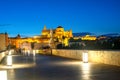 View at night across Roman bridge on Guadalquivir river of Great Mosque in Cordoba. Andalusia, Spain Royalty Free Stock Photo