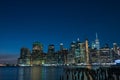 View of the night city. Glowing lights of skyscrapers. View of the city of New York and the bay. New York. Long light exposure. Royalty Free Stock Photo