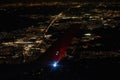 View of night city under the wing of airplane Royalty Free Stock Photo