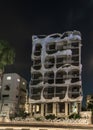 View at night on the decoratively decorated facade of the house - Crazy house - on the embankment in the old district of Tel Aviv Royalty Free Stock Photo