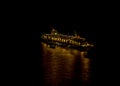 A view at night towards a cruise ship on the caldera below Thira, Santorini Royalty Free Stock Photo