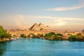 View on the Nile and the boats at sunset in the Aswan desert near the Pypamids of Egypt Royalty Free Stock Photo