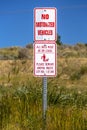 View of no motorized vehicles and dog leash sign Royalty Free Stock Photo