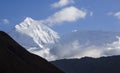 View of the north face of the Annapurna completely covered with snow with a blue sky background during the trek around the Royalty Free Stock Photo