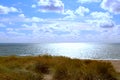 View at the North Sea from dunes against sun, Denmark