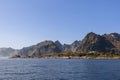 North sea, serene mountain ridge, Moskenes lighthouses, Lofoten Island, sunny Norwegian summer day Royalty Free Stock Photo