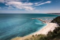 Italy May 2017 - view of Numana beach with crystal clear sea and limestone cliff Royalty Free Stock Photo