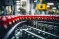 A view of numerous red glass bottles displayed in organized rows inside a manufacturing facility, Process of beverage