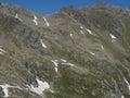 View on Nurnberger Hutte mountain hut at steep slope of snow-capped peaks at Stubai hiking trail, Stubai Hohenweg Royalty Free Stock Photo