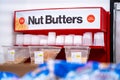 View of Nut Butters section with bulk nut containers in Bulk Barn. Royalty Free Stock Photo