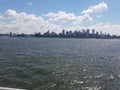 View of NY Harbor with distant skyline of NYC lower Manhattan