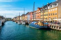 View of Nyhavn pier with color buildings, ships, yachts and other boats in the Old Town of Copenhagen, Denmark Royalty Free Stock Photo